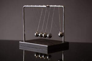 Newton cradle representing momentum